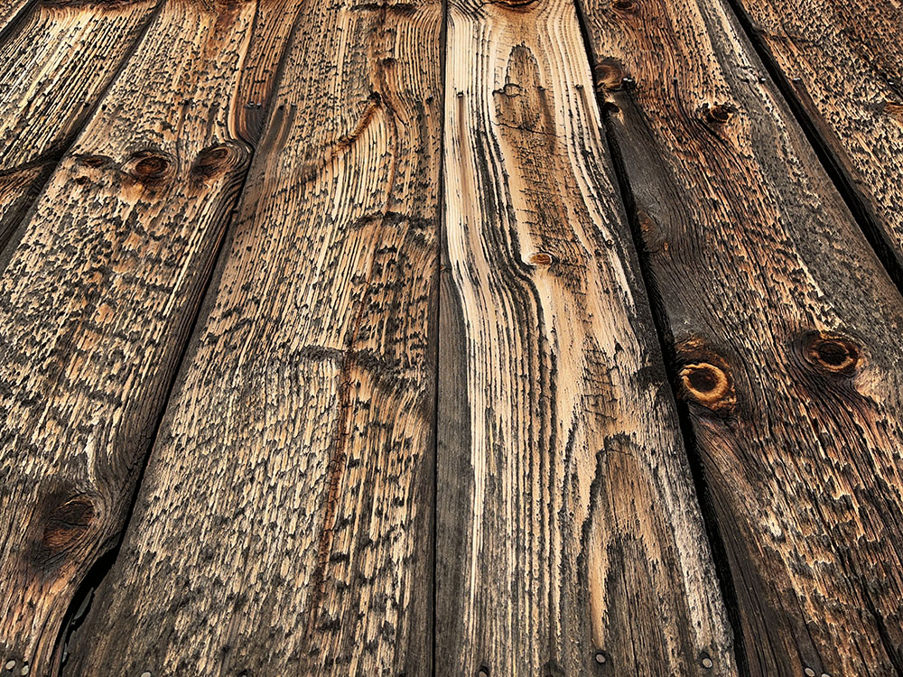 Nearly Abstract Image of Red Unfinished Wooden Siding.